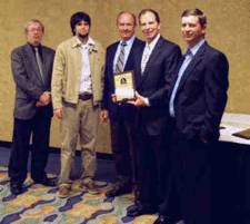 Peliton Plastics staff accept business of the year award
